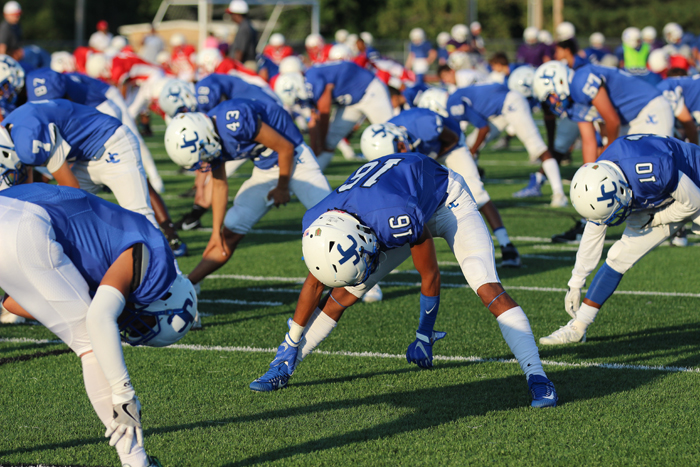The Junction City Blue Jays Football team stretching before the Blue/ White Scrimmage.