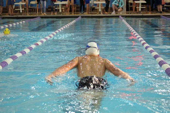 A JCHS swimmer swims the butterfly stroke.