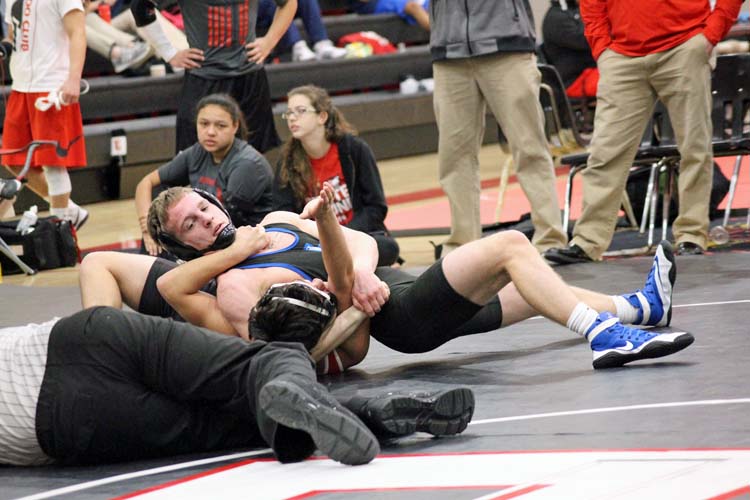 Max Bazan pins opponent, William Calixto, from Olathe North at the Emporia Winter Dual. 