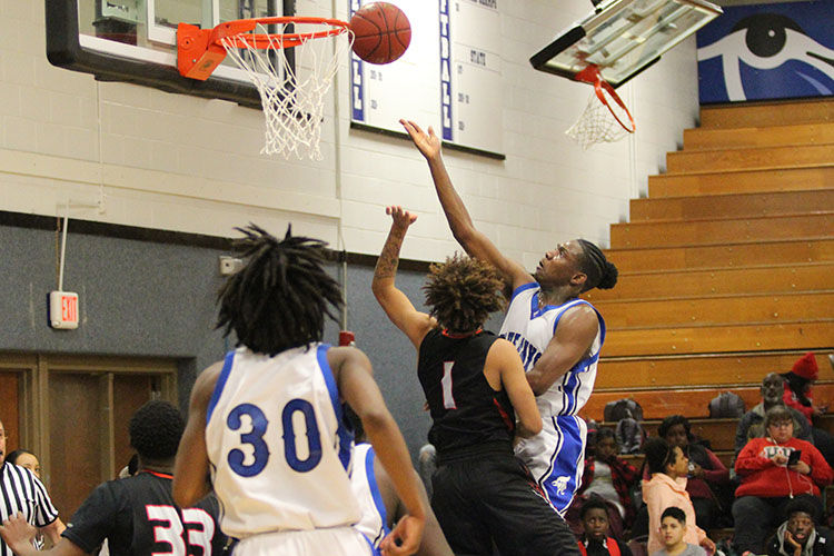AJ Dickerson goes up for a layup at the home basketball game on Friday, February 2.