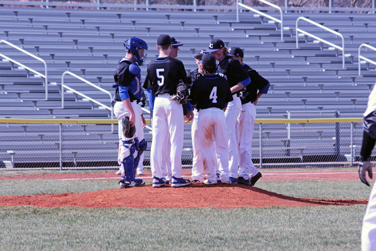The Junction City baseball team taking a team huddle on the mound at the home baseball game April 4th. 