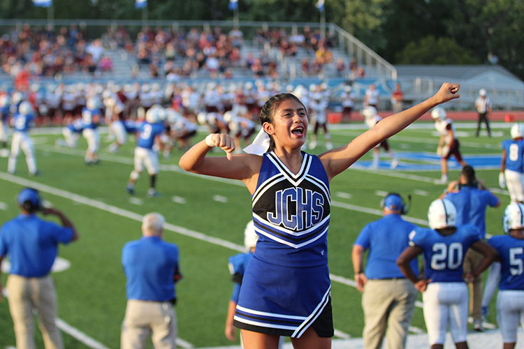 Cheer captain Cecilia Arredondo leads a chant at the game against Hays on Friday August 31st. 