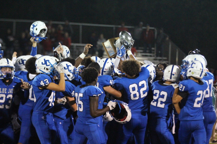 The Blue Jays hoist the Silver Trophy in victory over Manhattan High.