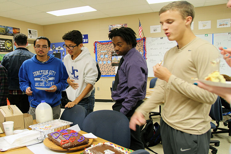 (From Left to Right) Odin Johnston, Aaron Reutzel, Julian Hill, and Kody Westerhaus examining the cakes. 