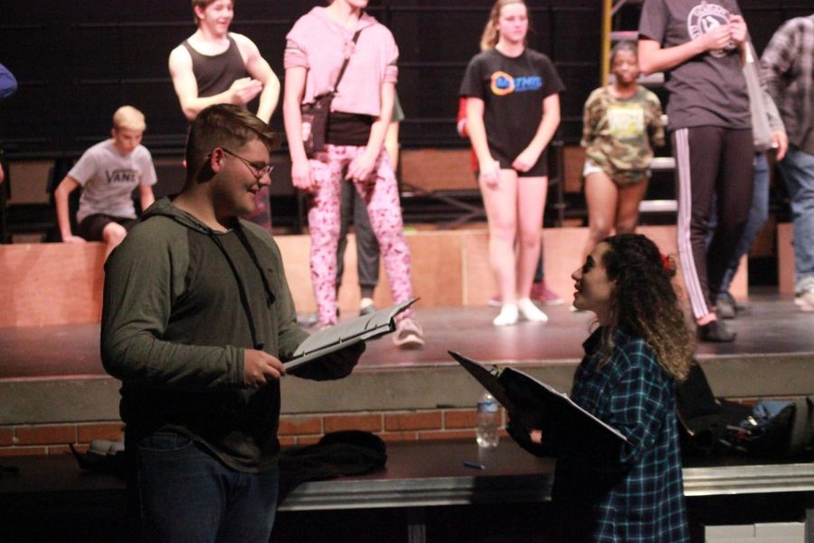 Senior student directors Charles (Dillon) Powell and Merve Aksu discussing the Pippen musical during rehearsal on January 18.   