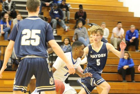 Boys Basketball Defeat Hayden, Move On To Topeka Trojans