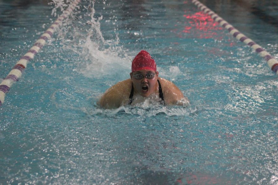 Sophomore Lauren Kim swims the butterfly stroke.