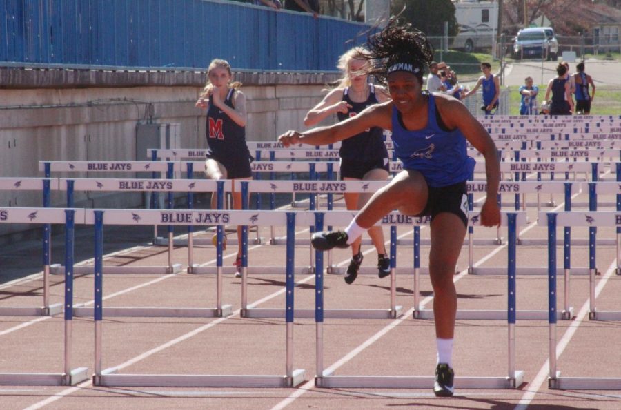 Keiana Newman, former state champion, competes in hurdles at the meet on April 9, 2019.