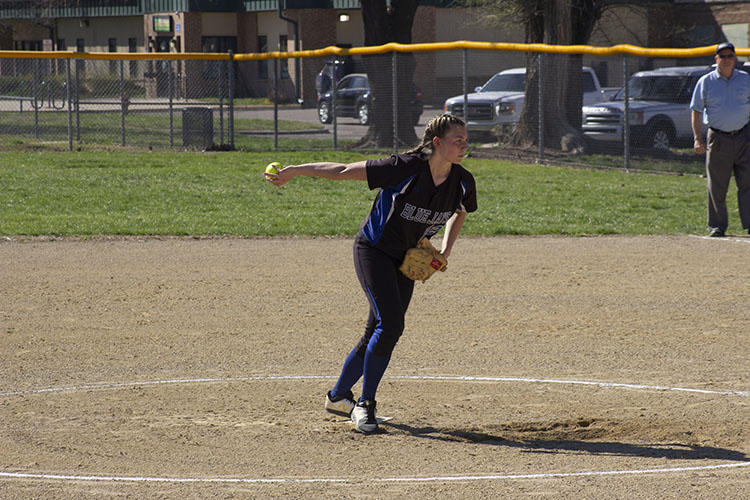 Taylor Strickland (10) is about to pitch a fastball.