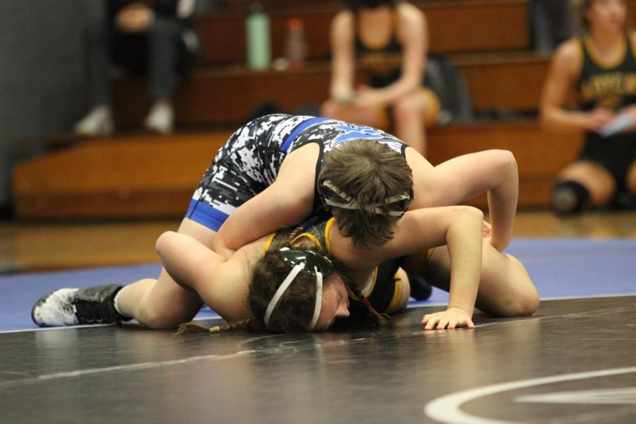 Junior Brooke Swango works to rotate her opponent to her back for the pin. Swango was one of five wrestling to compete at state. Although she didnt come home with a placing, Swango says she enjoyed the experience. 